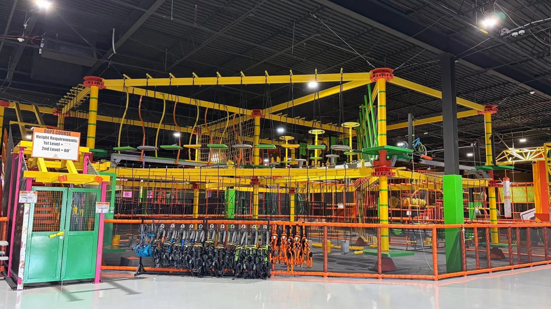 Rope course with entrance gates at Nova Adventure Park Reading